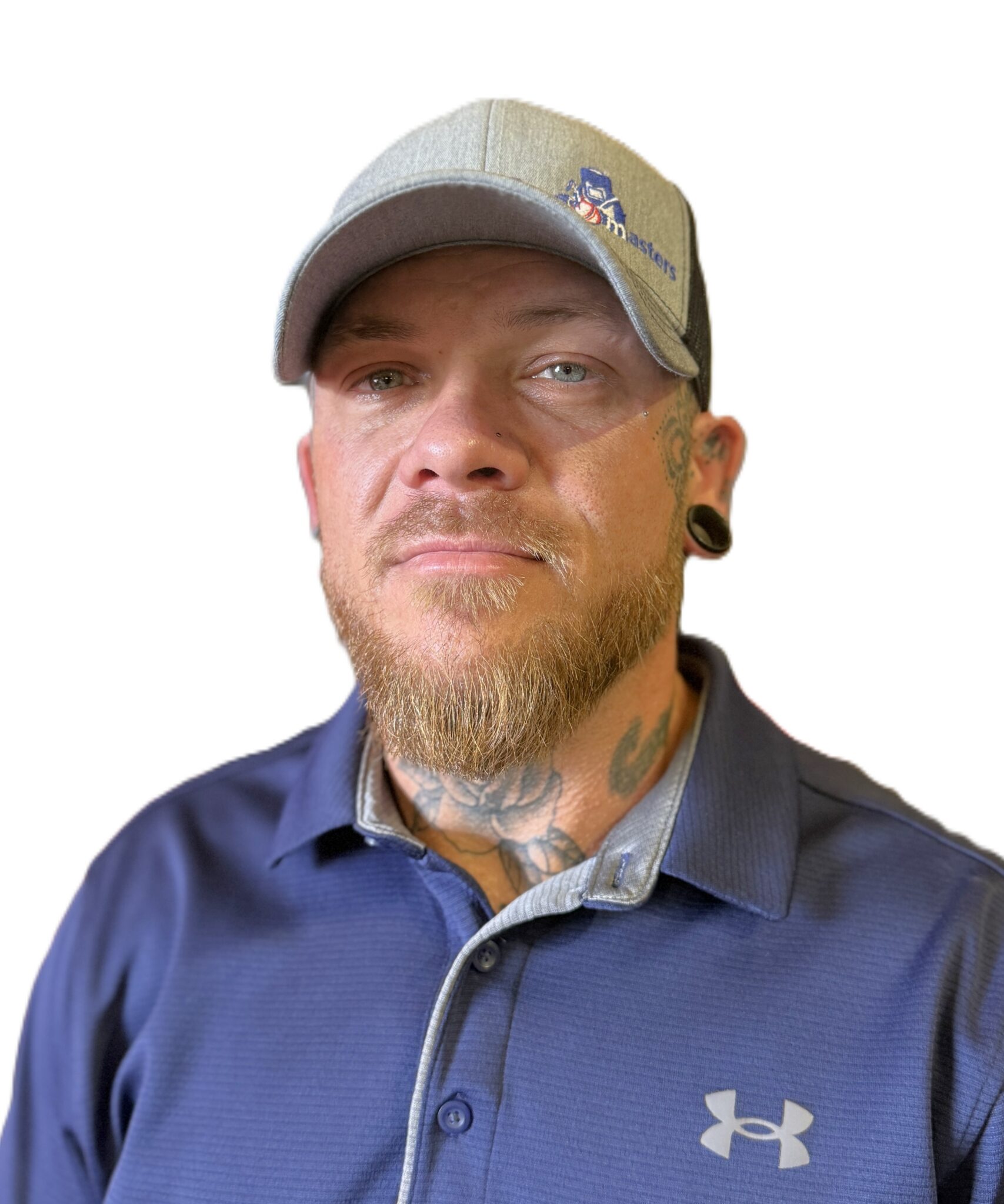 Tattooed man wearing a gray cap and polo.